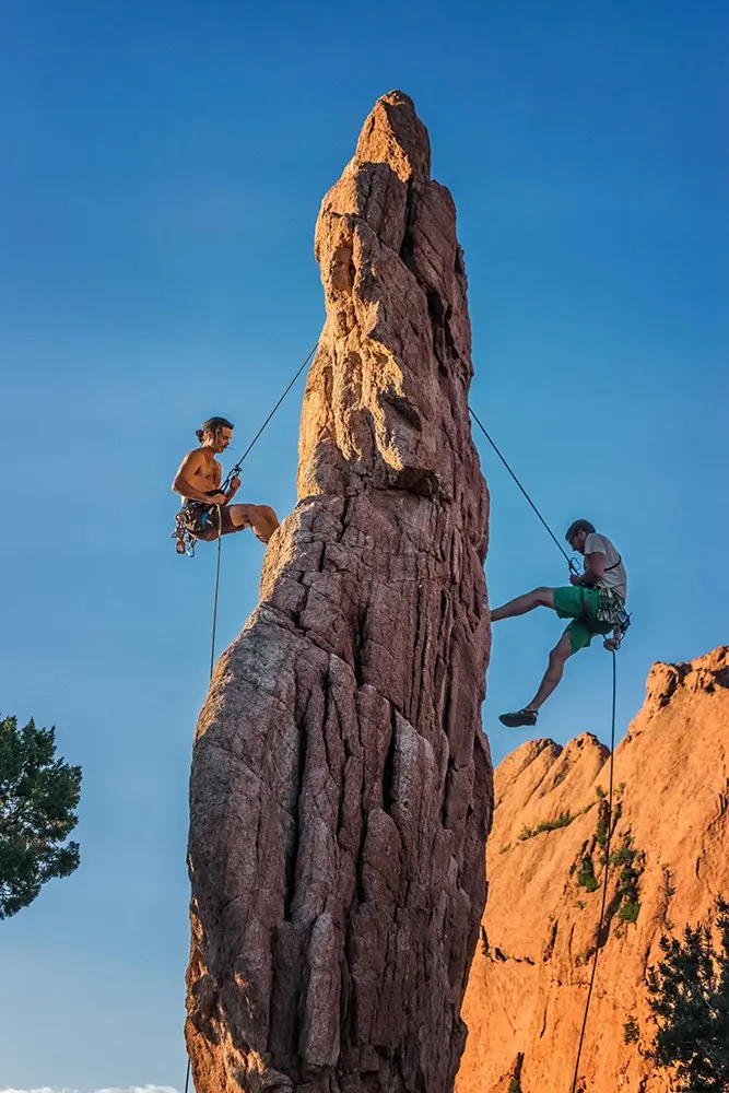 two people rock climbing