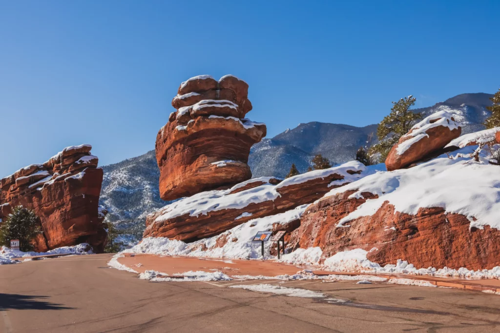 Balance rock with snow on the ground